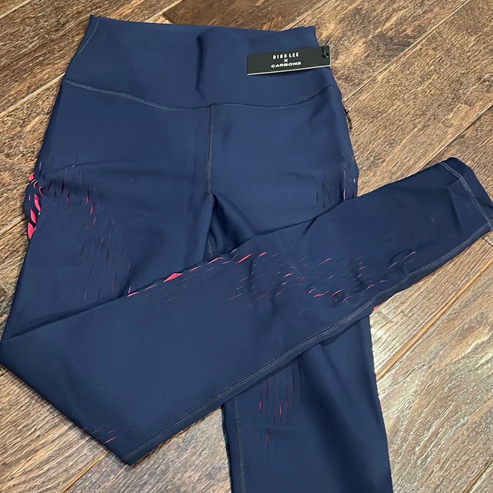 Navy with pink interior leggings. Size M from Carbon 38.
